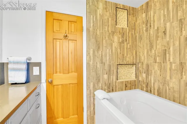 a view of a house with wooden deck