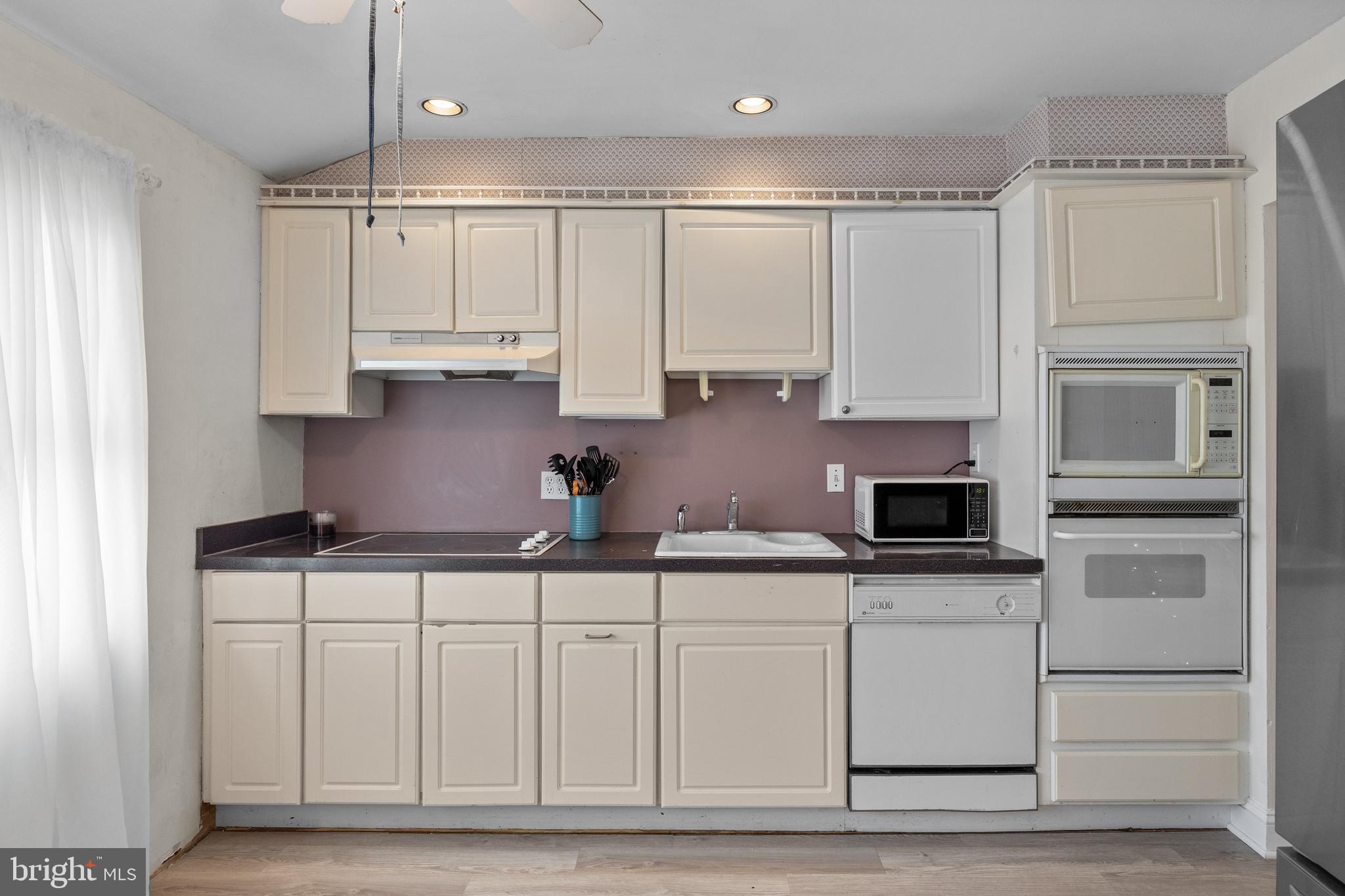 122 Hamilton Road Marlton, NJ 08053 - Photo 9 of 25 a kitchen with stainless steel appliances granite countertop a refrigerator sink and cabinets