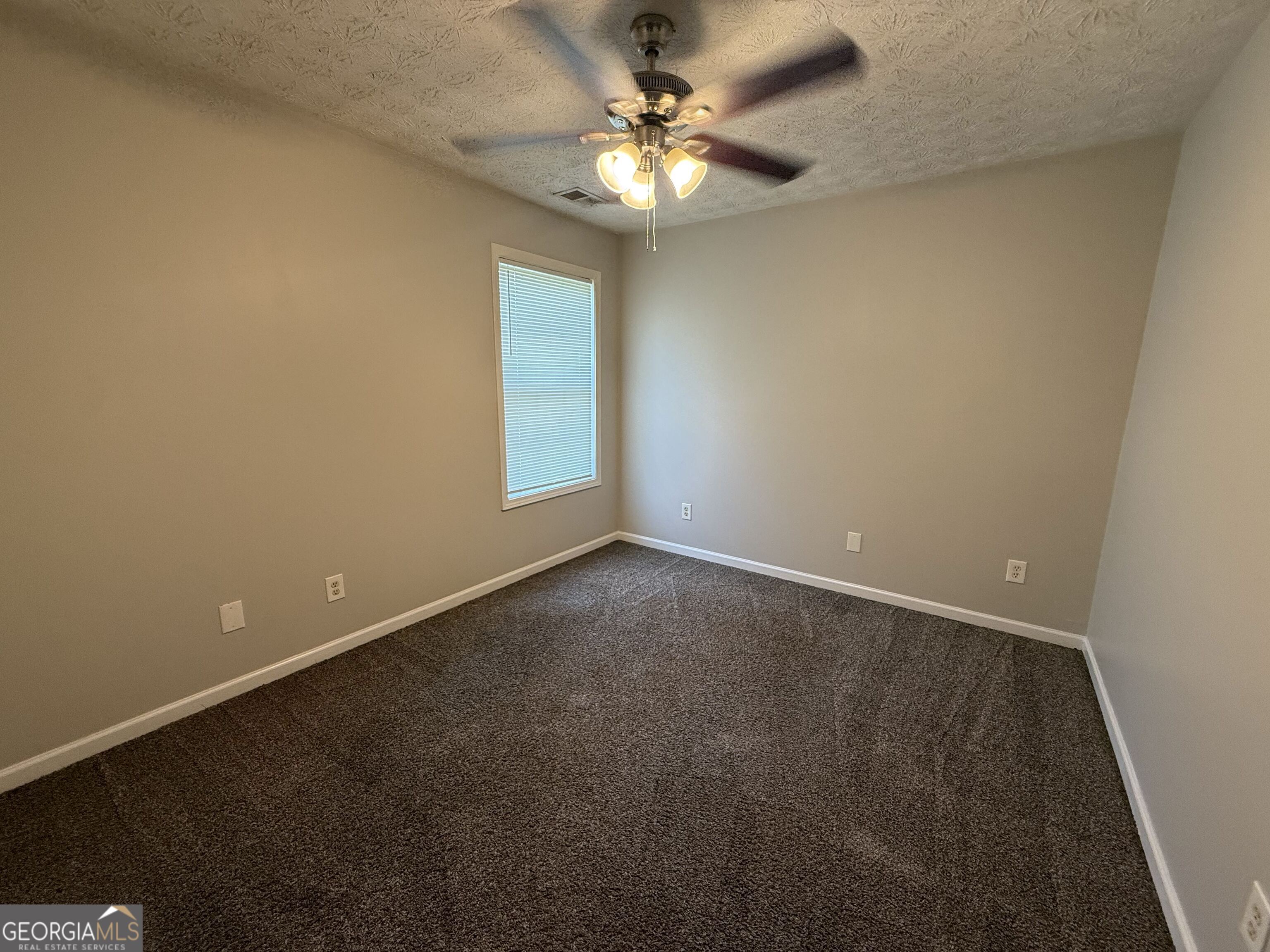 6132 Ruth Street Southwest Covington, GA 30014 - Photo 21 of 33 a view of an empty room with a window