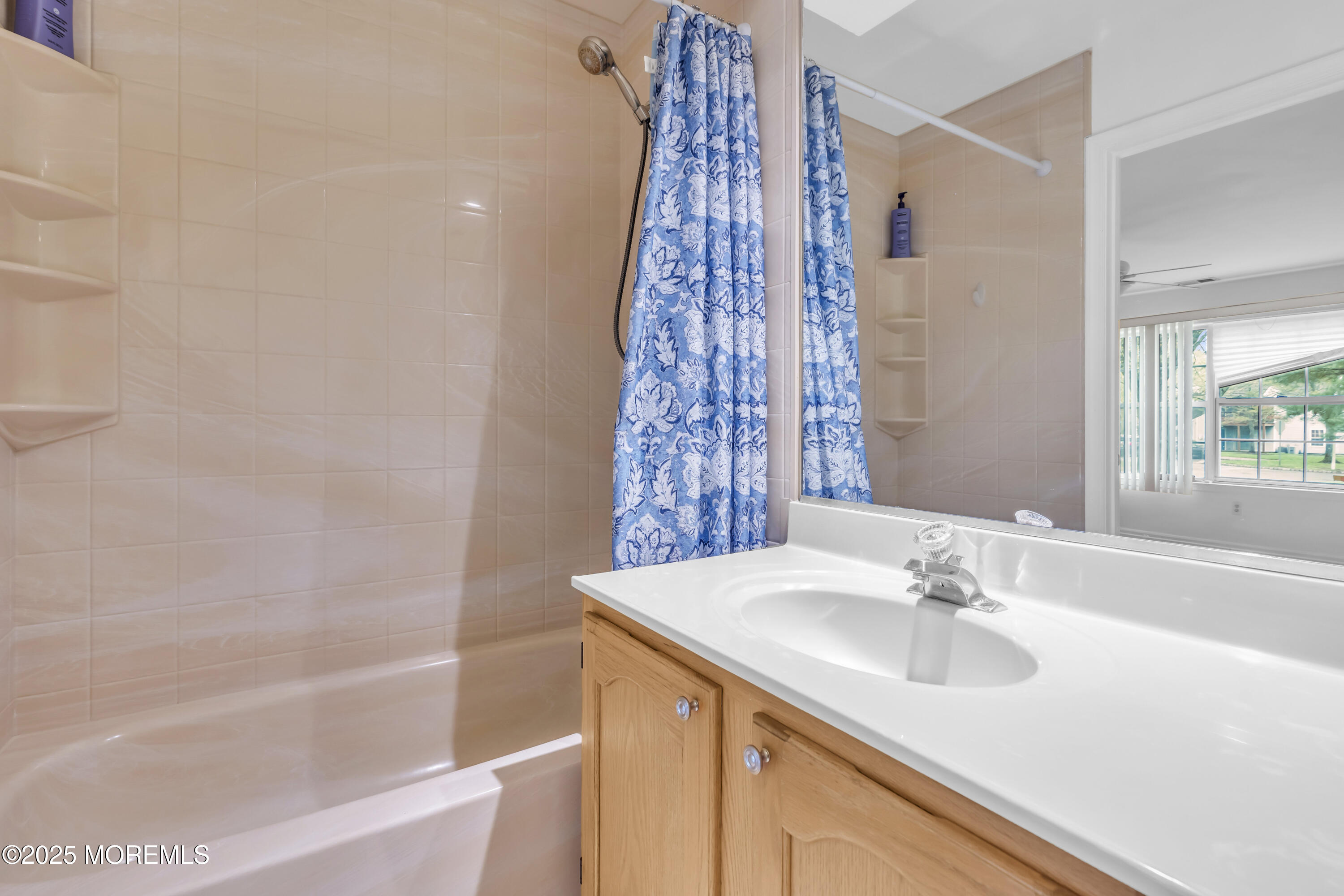 237 Paddington Court, Unit 87 Manalapan, NJ 07726 - Photo 21 of 23 a bathroom with a sink and a bathtub