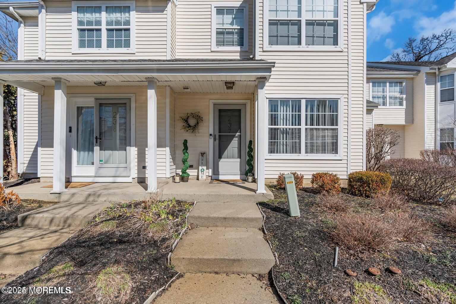 237 Paddington Court, Unit 87 Manalapan, NJ 07726 - Photo 3 of 23 a front view of a house