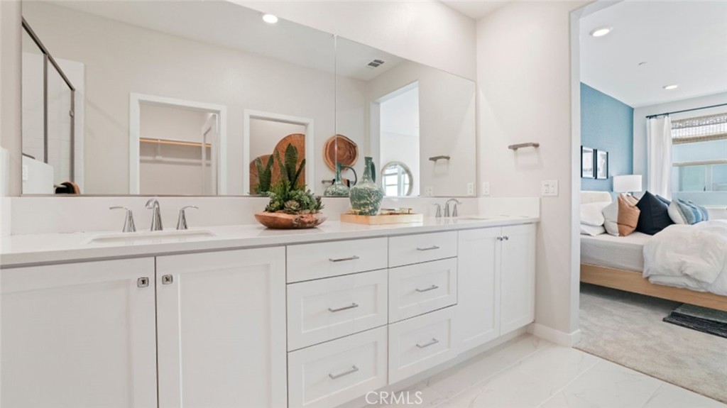 348 Mulberry Place Montebello, CA 90640 - Photo 16 of 39 a bathroom with a double vanity sink and mirror