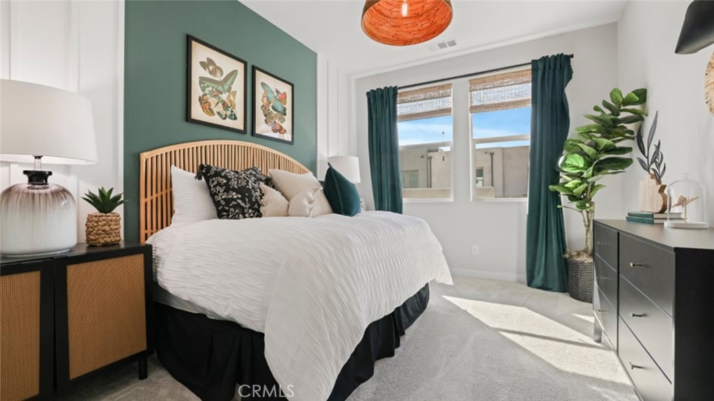 348 Mulberry Place Montebello, CA 90640 - Photo 22 of 39 a bedroom with a bed and a potted plant on the dresser