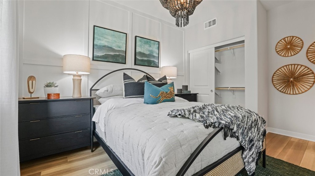 348 Mulberry Place Montebello, CA 90640 - Photo 27 of 39 a bedroom with a bed and a chandelier