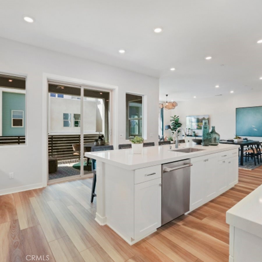 348 Mulberry Place Montebello, CA 90640 - Photo 3 of 39 a kitchen with white cabinets and sink