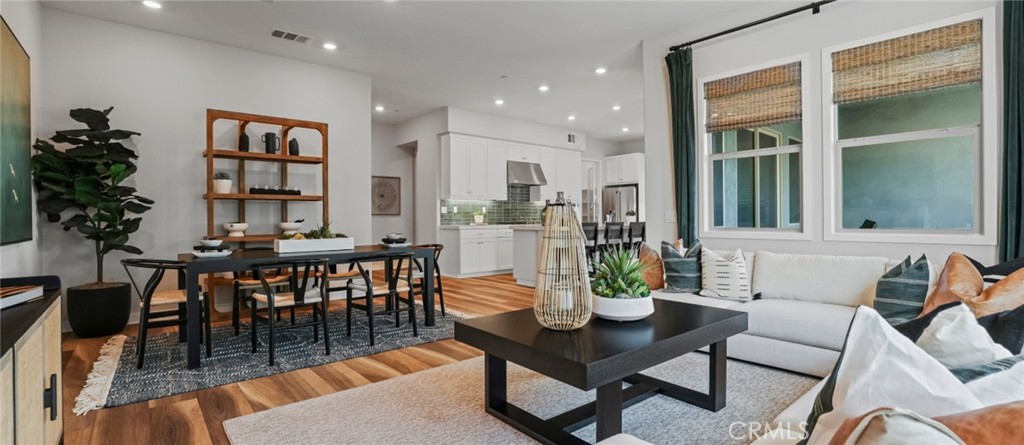 348 Mulberry Place Montebello, CA 90640 - Photo 8 of 39 a dining room with furniture a table and a potted plant