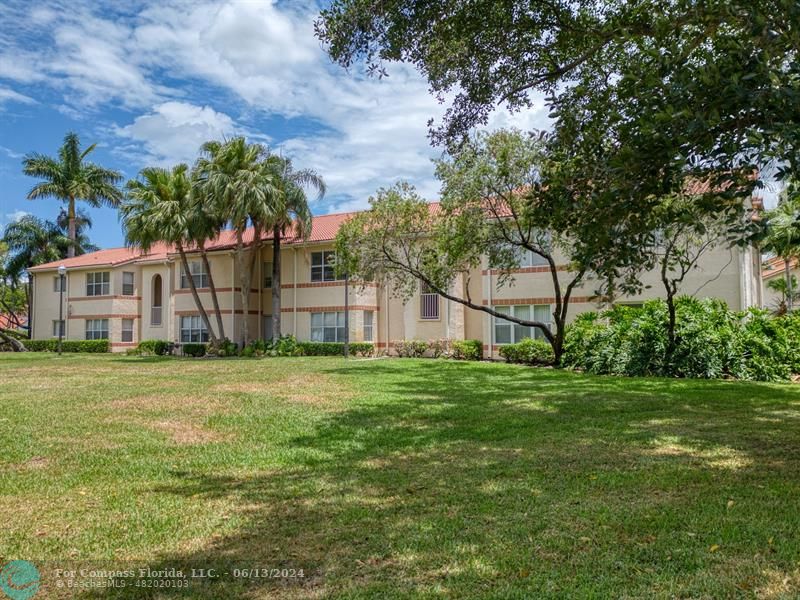 3410 Pinewalk Drive North, Unit 812 Pompano Beach, FL 33063 - Photo 1 of 26 a view of a house with a yard