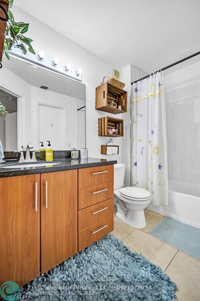 3410 Pinewalk Drive North, Unit 812 Pompano Beach, FL 33063 - Photo 15 of 26 a bathroom with a sink a toilet and shower