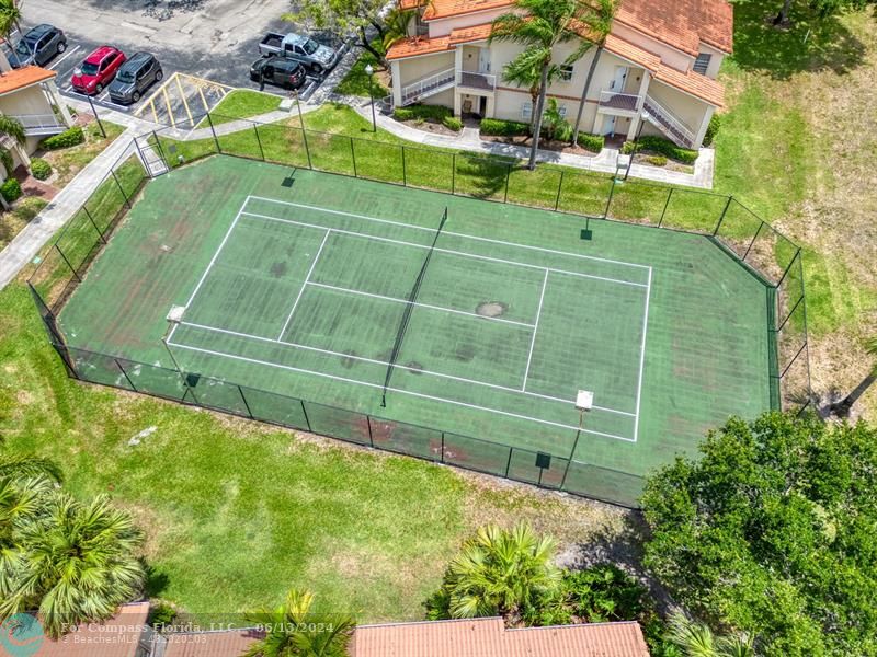 3410 Pinewalk Drive North, Unit 812 Pompano Beach, FL 33063 - Photo 20 of 26 a view of a tennis court