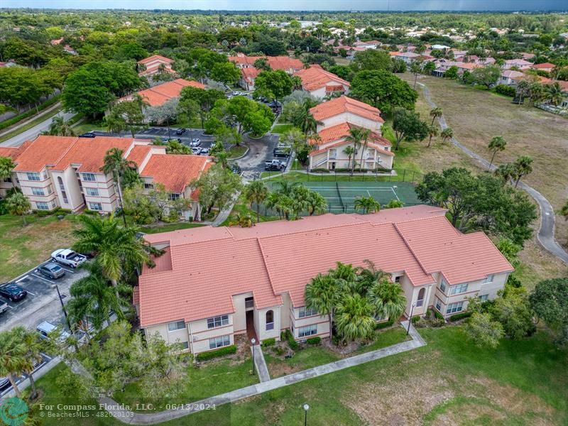 3410 Pinewalk Drive North, Unit 812 Pompano Beach, FL 33063 - Photo 24 of 26 an aerial view of house with swimming pool yard and outdoor seating