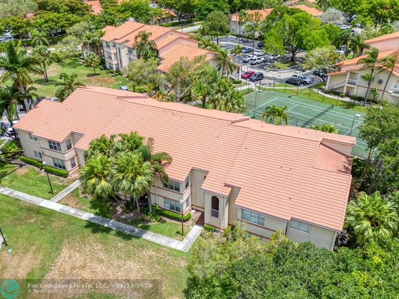 3410 Pinewalk Drive North, Unit 812 Pompano Beach, FL 33063 - Photo 25 of 26 an aerial view of a house with a yard and lake view