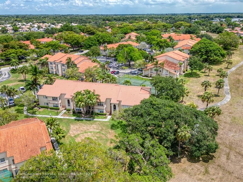 3410 Pinewalk Drive North, Unit 812 Pompano Beach, FL 33063 - Photo 26 of 26 an aerial view of residential houses with outdoor space and street view