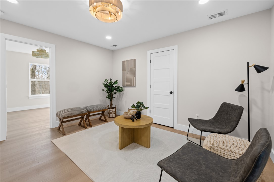 322 Oconee Avenue Westminster, SC 29693 - Photo 22 of 43 This bright room features warm wood flooring and ample natural light, perfect for a cozy retreat.