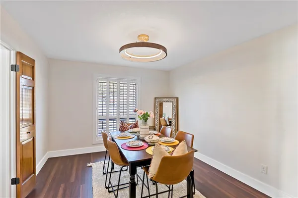 a view of a room with furniture wooden floor and front door
