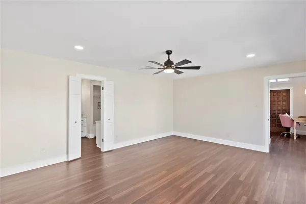 a view of a room with wooden floor and closet