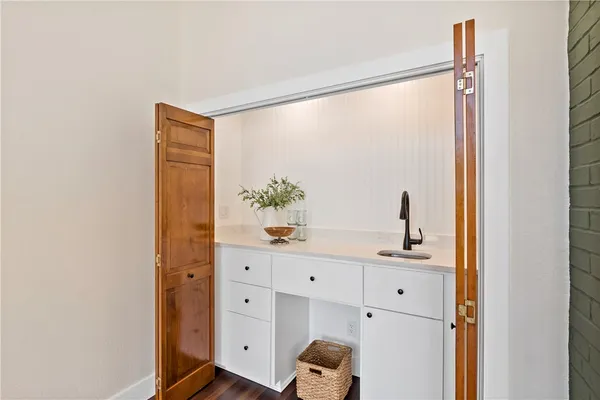 a view of cabinets a sink and a window