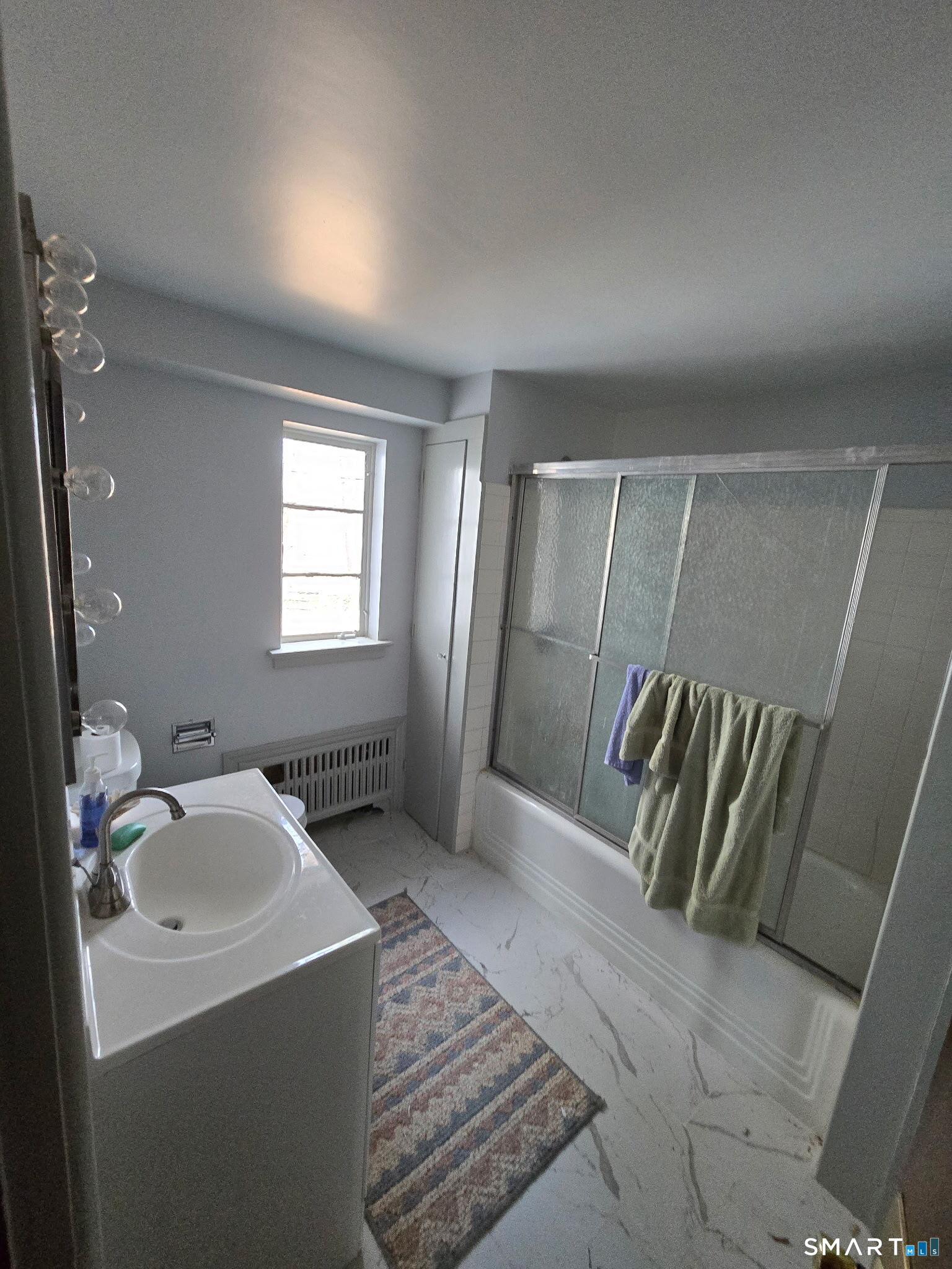 677 West Hill Road Stamford, CT 06902 - Photo 14 of 28 a bathroom with a sink and mirror