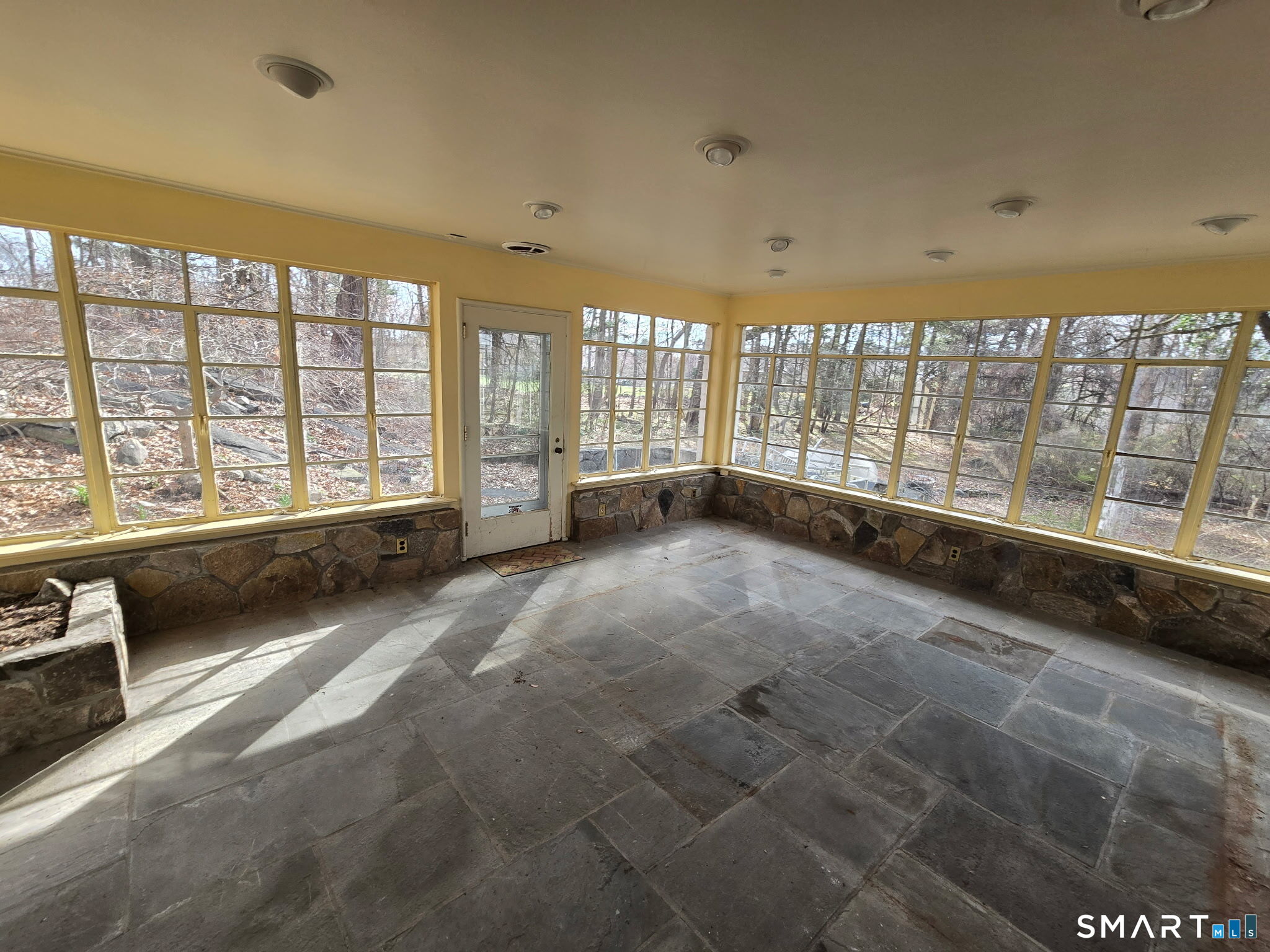 677 West Hill Road Stamford, CT 06902 - Photo 17 of 28 a large room with a large window and bed