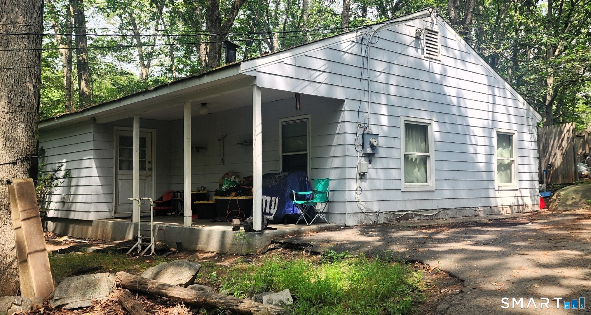 677 West Hill Road Stamford, CT 06902 - Photo 3 of 5 a front view of a house with a yard