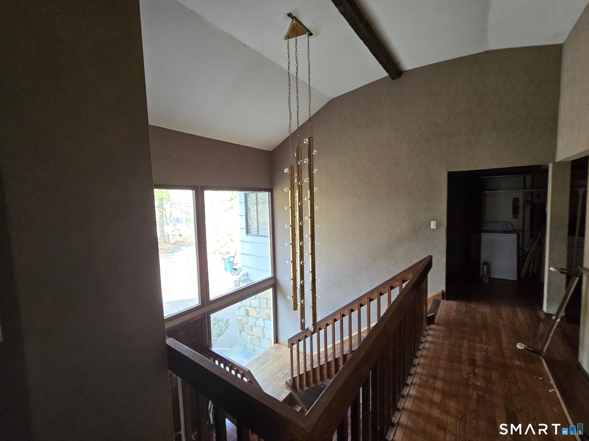 677 West Hill Road Stamford, CT 06902 - Photo 9 of 28 a view of a hallway with wooden floor and staircase