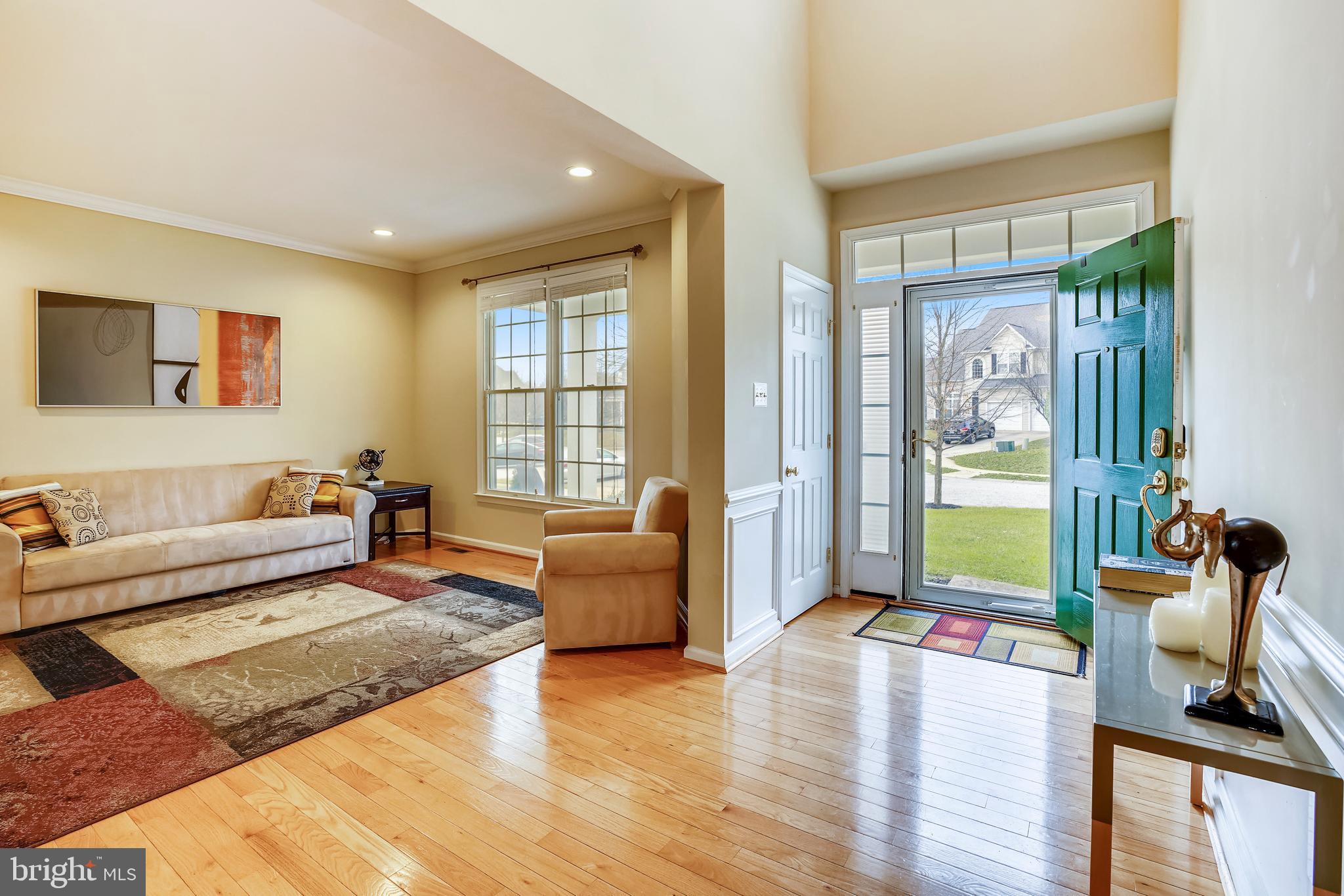 9617 Dapper Town Row Laurel, MD 20723 - Photo 3 of 36 The 2 story foyer leads into the open living area