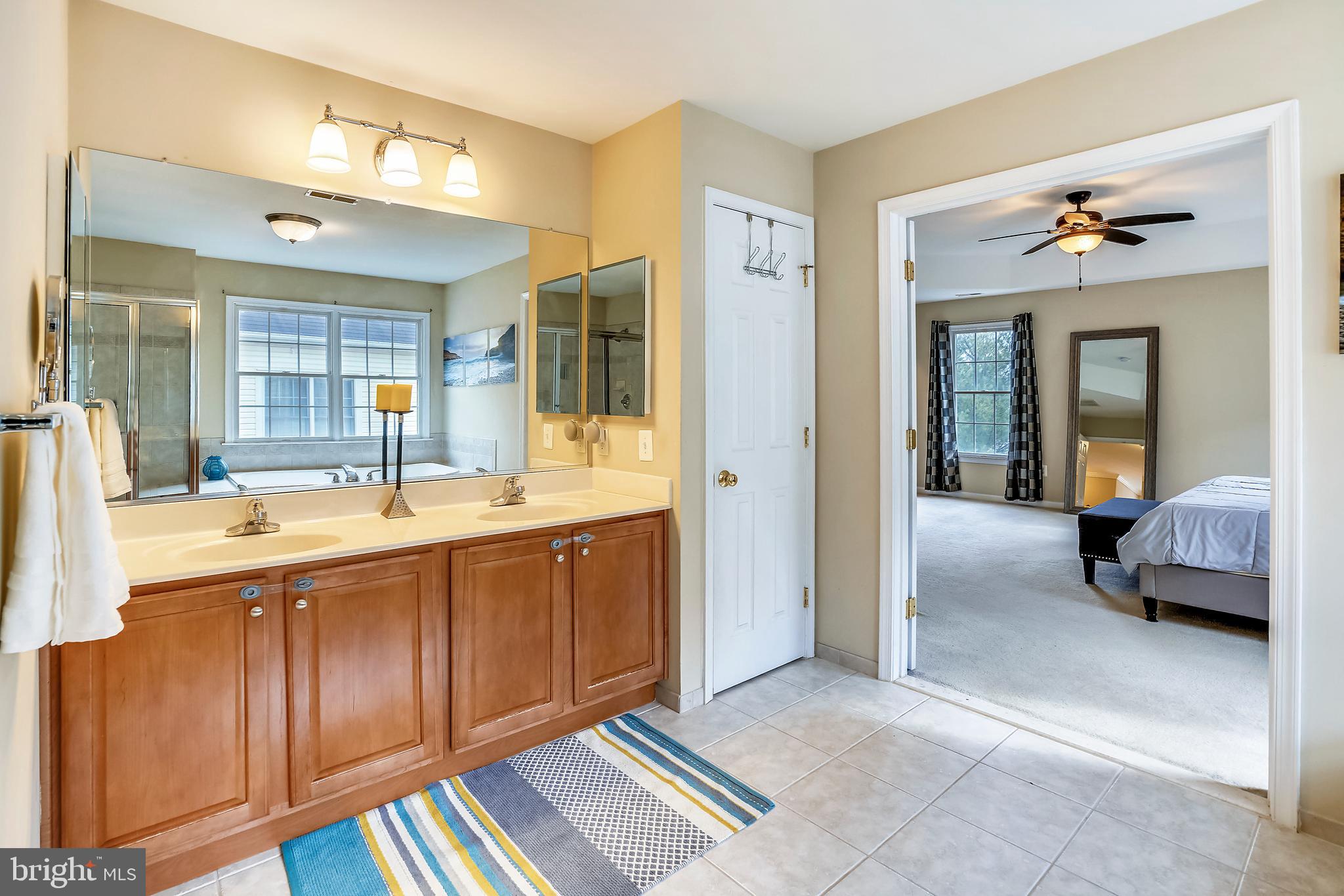 9617 Dapper Town Row Laurel, MD 20723 - Photo 25 of 36 Master Bath with double door entry to M Br.