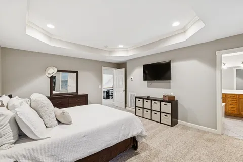 a bathroom with a double vanity sink mirror and toilet