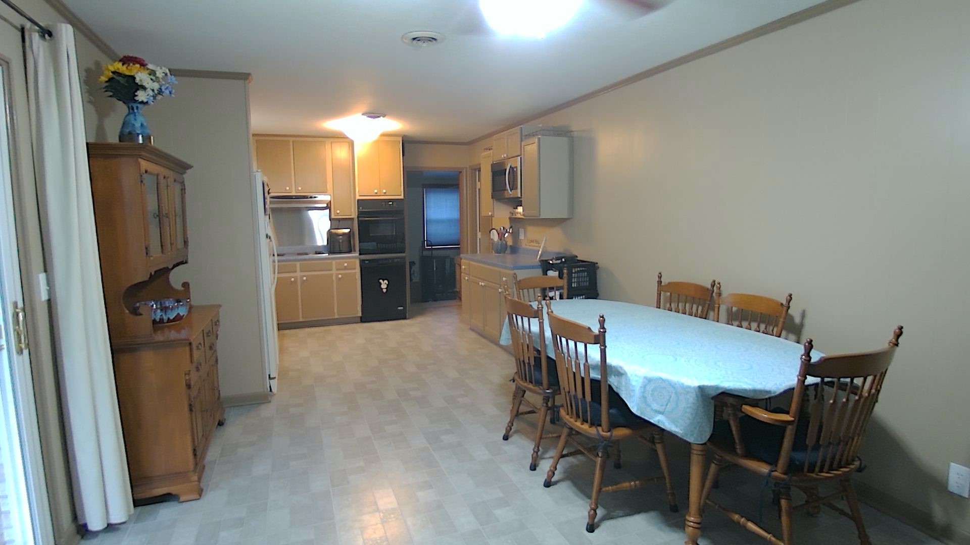 281 Le Bon Road Nashville, TN 37211 - Photo 8 of 30 a view of a dining room with furniture and a refrigerator