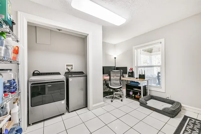 a kitchen with a sink cabinets and appliances