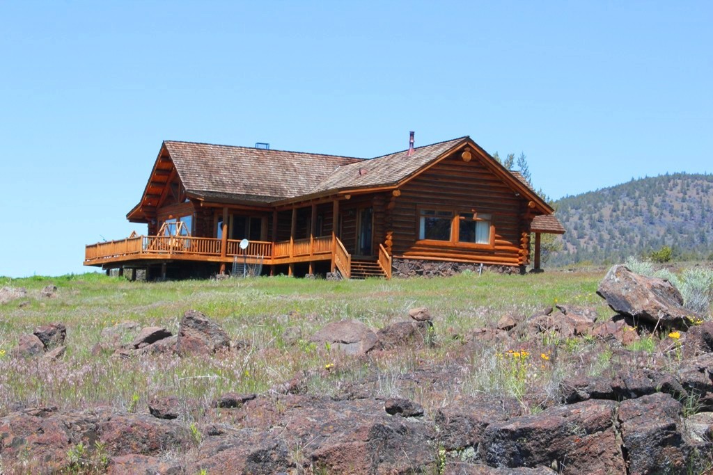 663-150 Dixie Ranch Road McArthur, CA 96056 - Photo 3 of 40 a front view of a house with garden