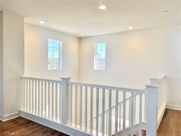a view of a hallway with windows