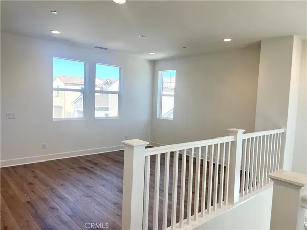 a view of hallway with windows