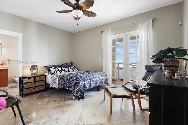 a bedroom with bed and a window