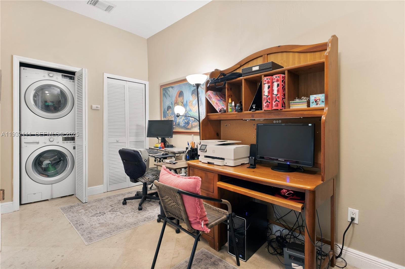 929 Southwest 11th Street, Unit H2 Miami, FL 33129 - Photo 19 of 46 a view of a workspace with furniture and a fireplace