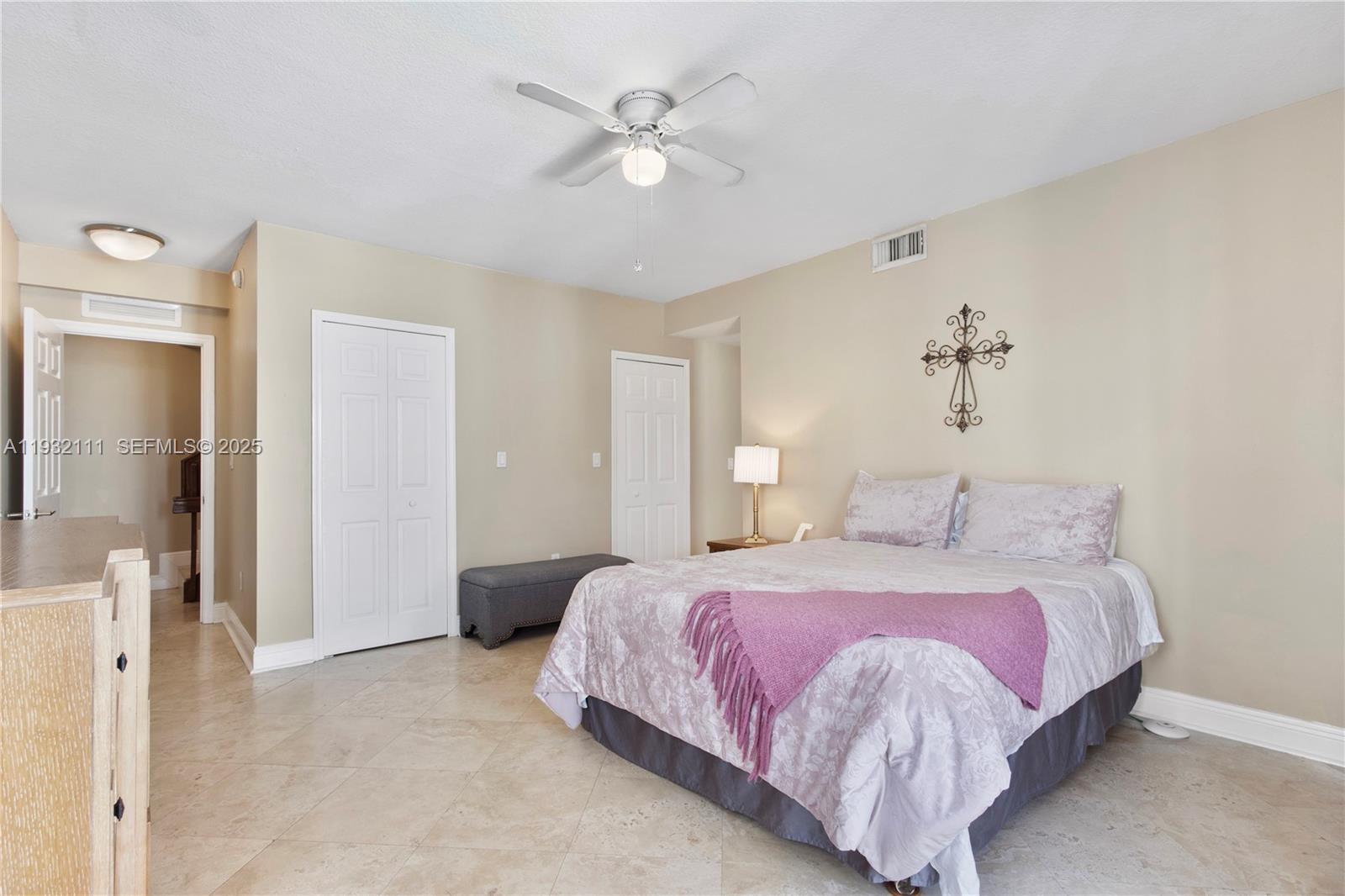 929 Southwest 11th Street, Unit H2 Miami, FL 33129 - Photo 30 of 46 a bedroom with a bed and a ceiling fan