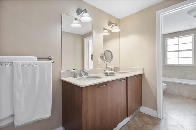 a view of a white building with many windows