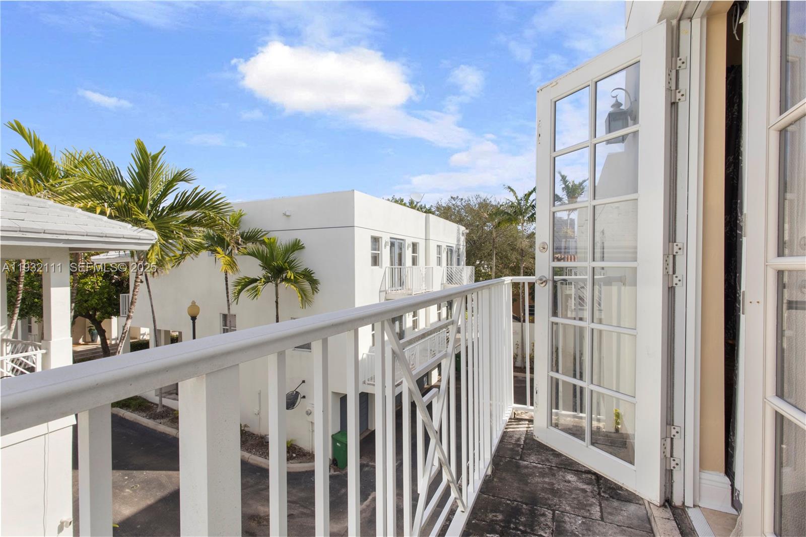 929 Southwest 11th Street, Unit H2 Miami, FL 33129 - Photo 35 of 46 a view of a balcony with potted plants