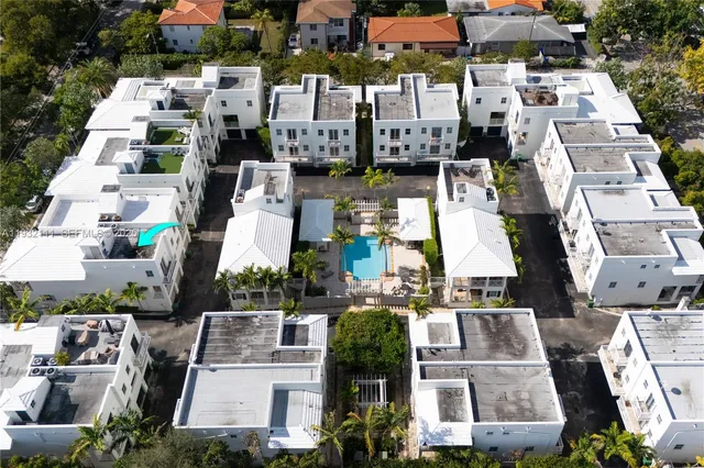 an aerial view of a city with lots of residential buildings