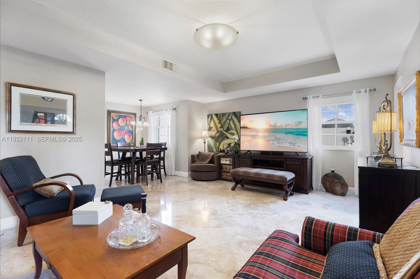 929 Southwest 11th Street, Unit H2 Miami, FL 33129 - Photo 5 of 46 a living room with furniture and wooden floor