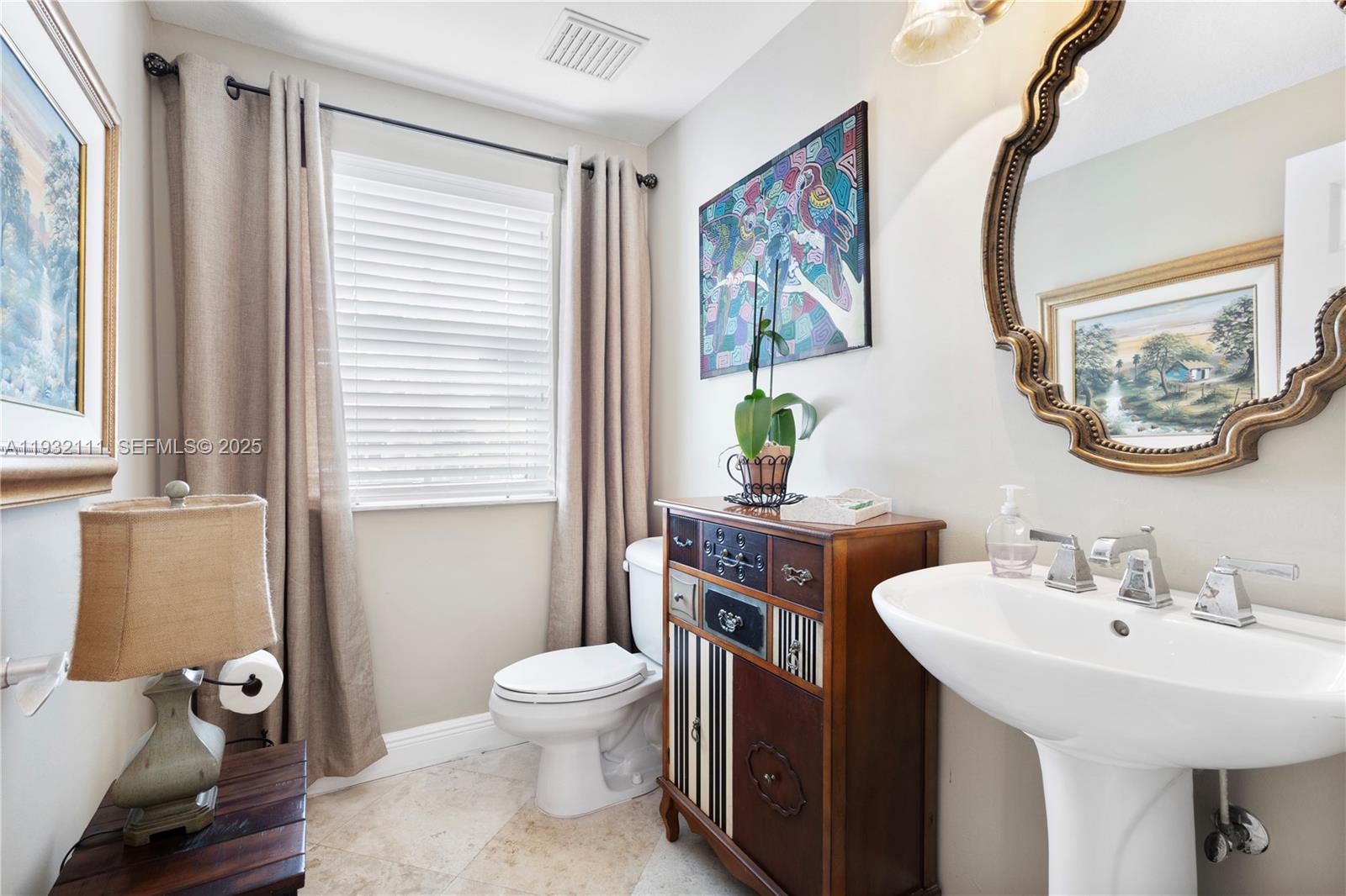 929 Southwest 11th Street, Unit H2 Miami, FL 33129 - Photo 8 of 46 a bathroom with a toilet sink and mirror