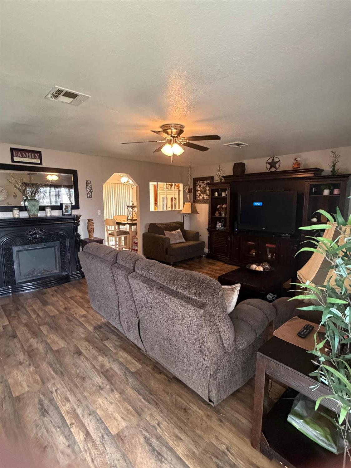 5109 Center Avenue Modesto, CA 95357 - Photo 18 of 45 a living room with furniture and fireplace