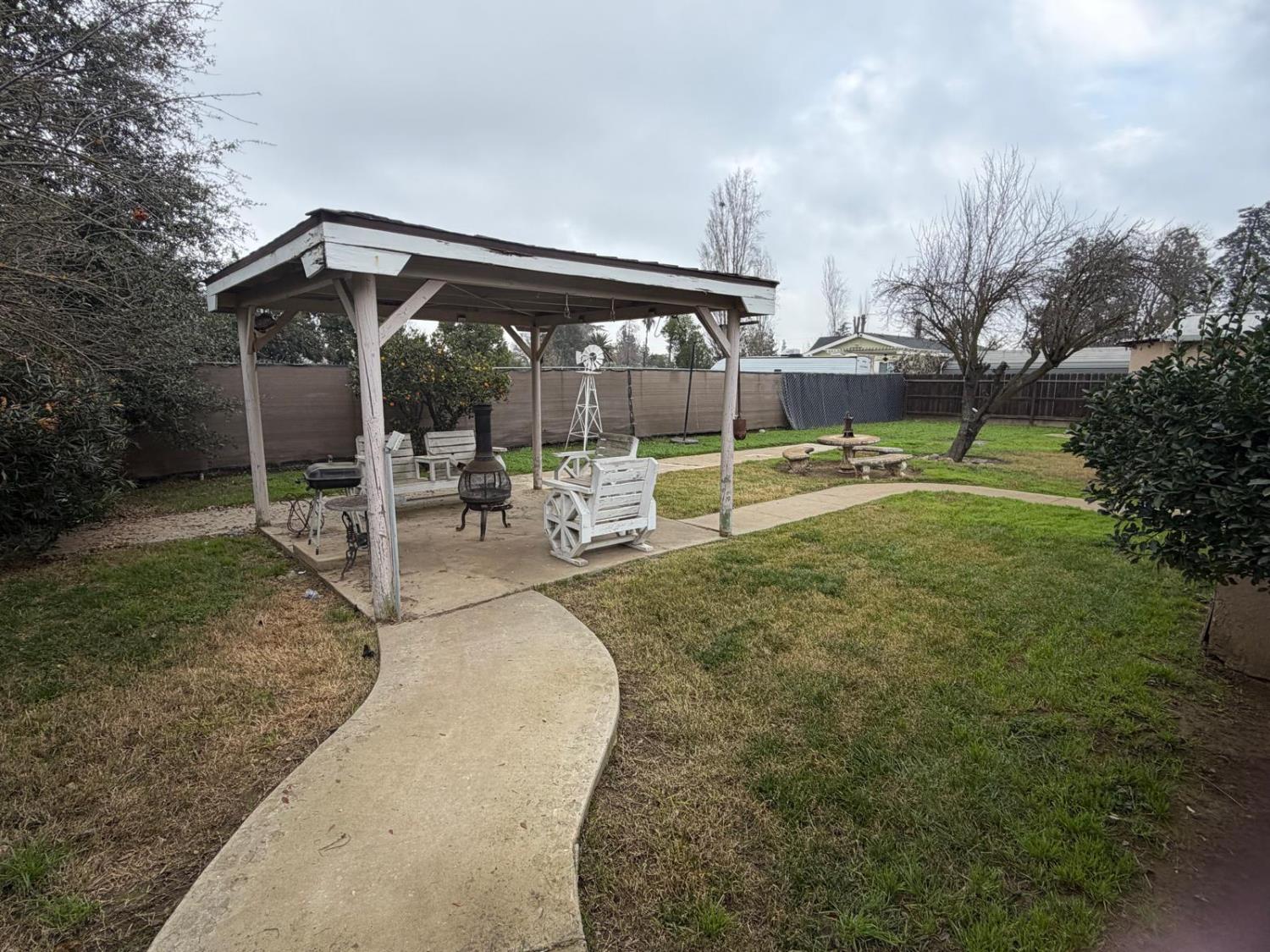 5109 Center Avenue Modesto, CA 95357 - Photo 20 of 45 a view of a house with backyard and sitting area