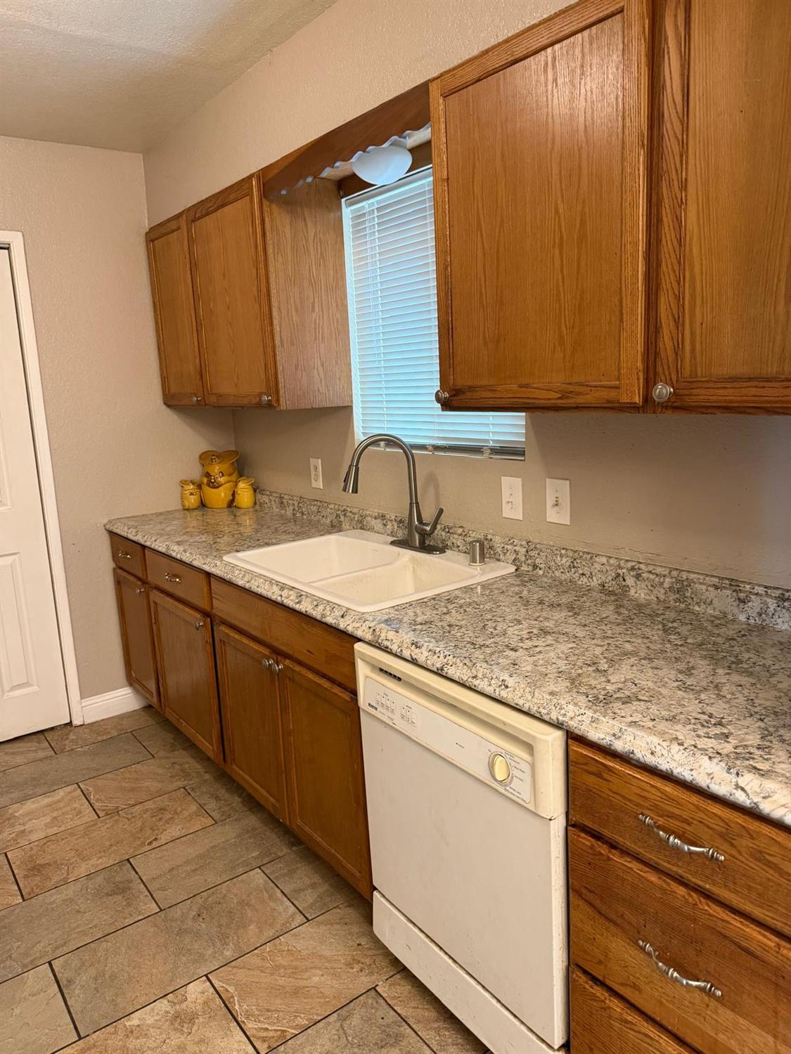 5109 Center Avenue Modesto, CA 95357 - Photo 24 of 45 a kitchen with stainless steel appliances granite countertop a sink and cabinets