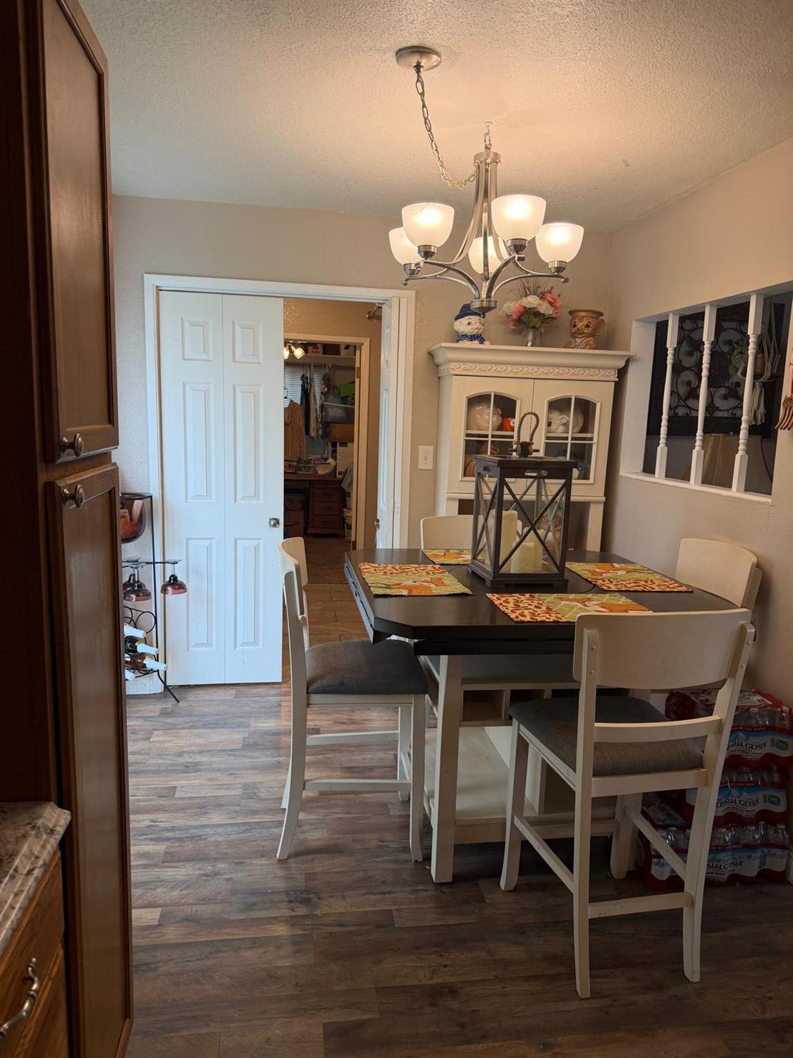 5109 Center Avenue Modesto, CA 95357 - Photo 25 of 45 a view of a dining room with furniture and wooden floor