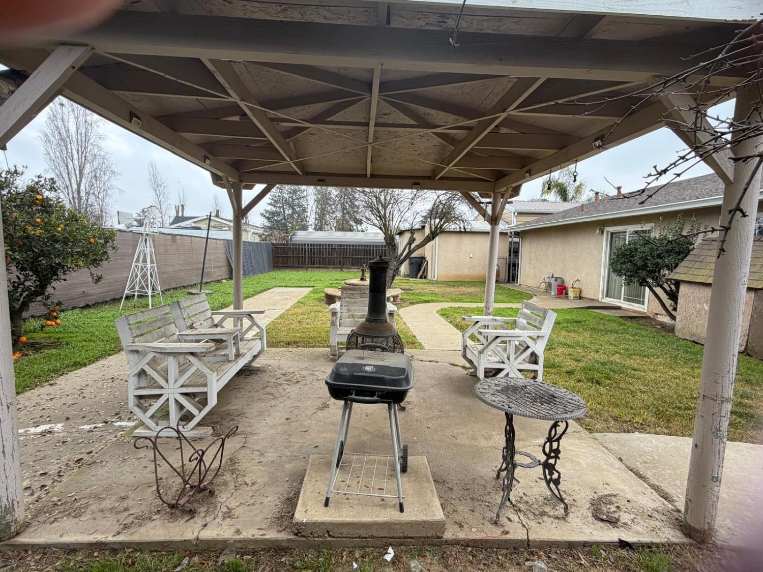 5109 Center Avenue Modesto, CA 95357 - Photo 27 of 45 a view of a porch with furniture and a yard