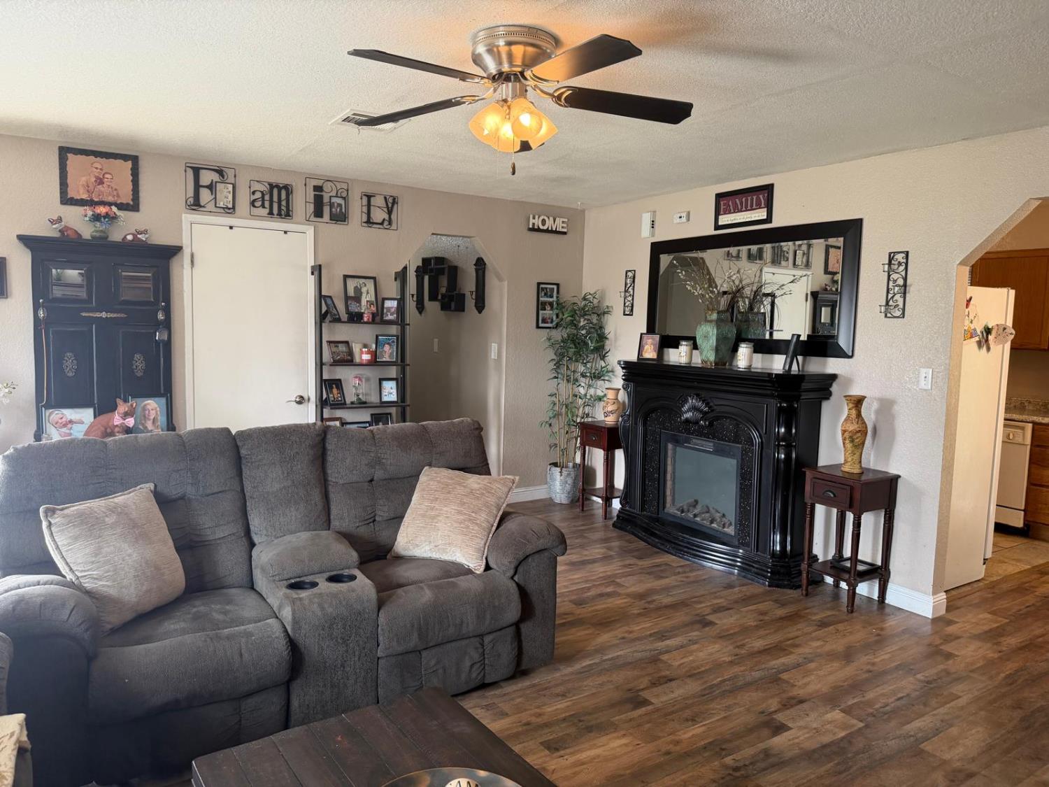 5109 Center Avenue Modesto, CA 95357 - Photo 43 of 45 a living room with furniture and a fireplace