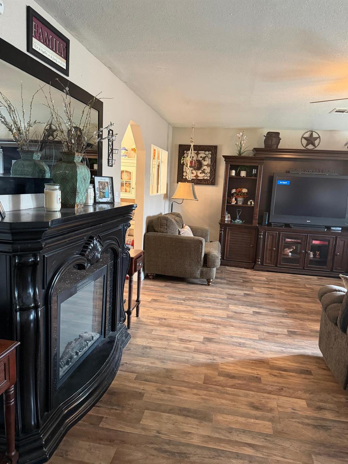 5109 Center Avenue Modesto, CA 95357 - Photo 7 of 45 a living room with furniture and a fireplace