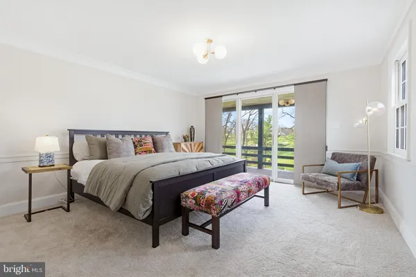a bedroom with a bed and a couch