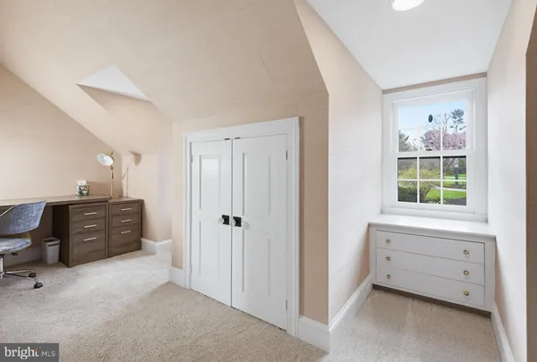a view of room with cabinet and windows