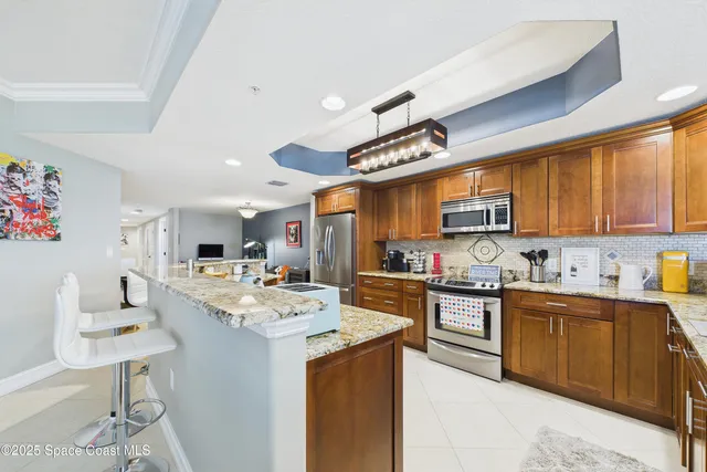 a bedroom with furniture and a book shelf